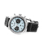 The Breitling Top Time B01 Triumph features a stainless steel case, light blue dial with black subdials, and a black perforated leather strap with white stitching—designed as a tribute to the Triumph collaboration.