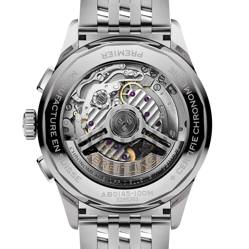 Close-up of the Breitling Premier B01 Chronograph 42, showing its exposed mechanical movement with detailed gears and a labeled rotor, all within a stainless steel case engraved with text.