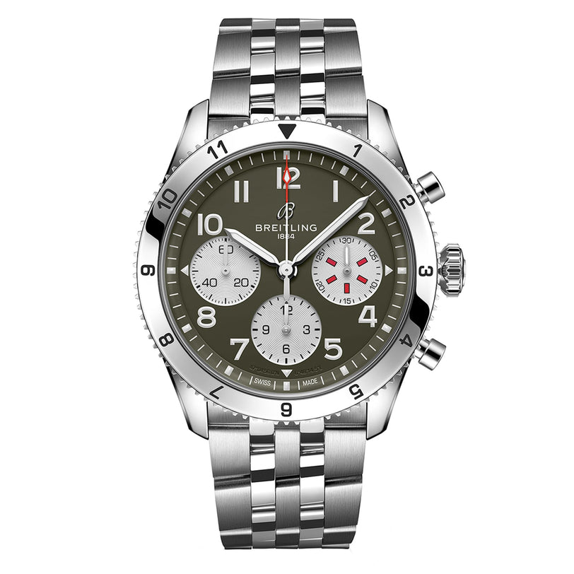 The Breitling Classic AVI Chronograph 42 Curtiss Warhawk is a silver pilots watch featuring a green dial, three subdials, silver hour markers, and a metal link bracelet.