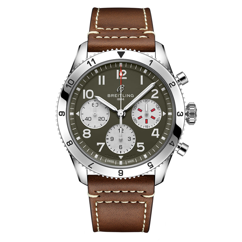 The Breitling Classic AVI Chronograph 42 Curtiss Warhawk features an olive green dial, white subdials, silver bezel, and brown leather strap with white stitching, powered by the precise Breitling 23 calibre.
