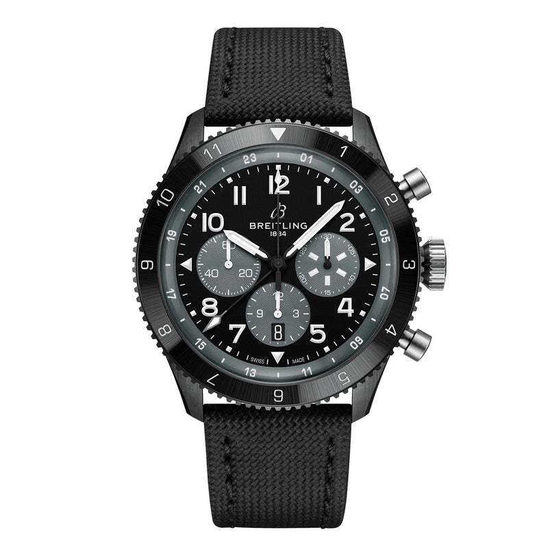 The Breitling Super AVI B04 Chronograph GMT Mosquito Night features a black face with white markers, multiple subdials, and a black fabric strap—an aviation-inspired wristwatch honoring the iconic de Havilland Mosquito.