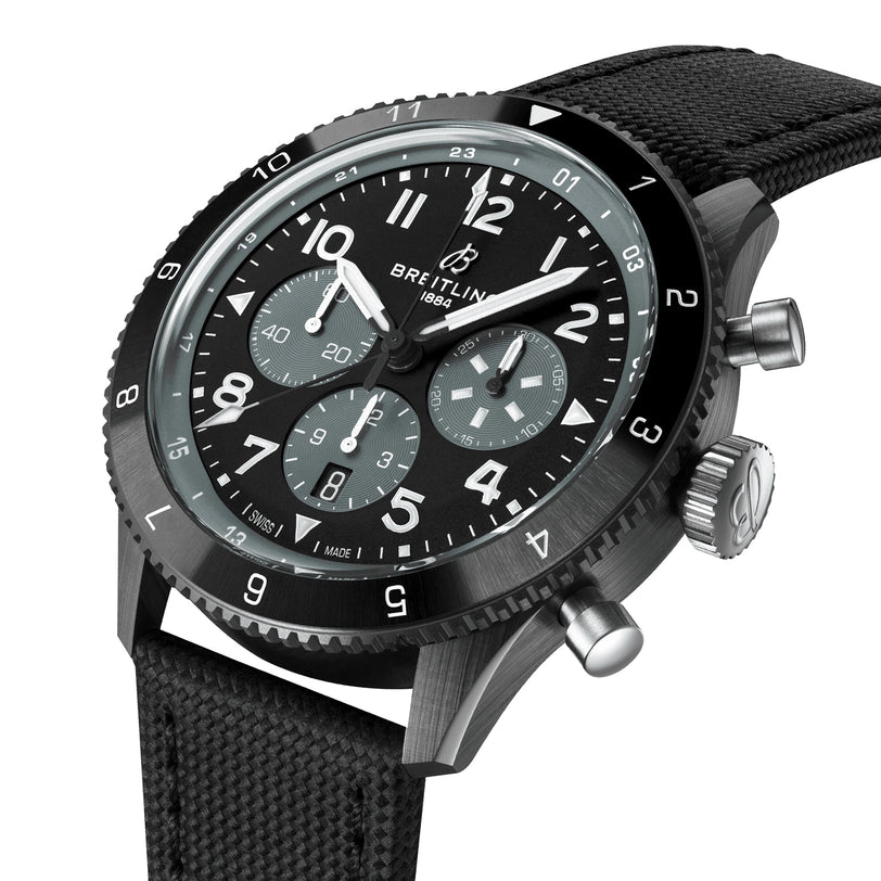 The Breitling Super AVI B04 Chronograph GMT Mosquito Night features a black strap, black bezel, black and gray dial with white hour markers and three subdials, honoring aviation history and the legendary de Havilland Mosquito.