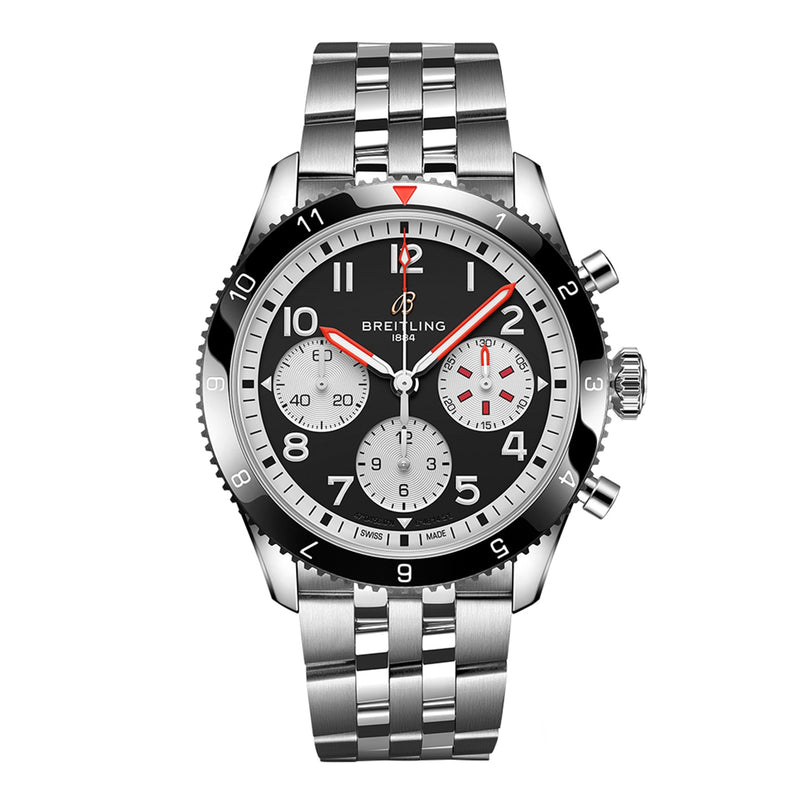 The Breitling Classic AVI Chronograph 42 Mosquito, a stainless steel wristwatch with a black dial, three subdials, red accents, and a metal link bracelet, is displayed on a white background.
