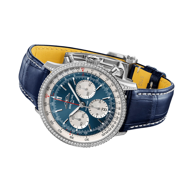 The Breitling Navitimer B01 Chronograph 41 features a silver and blue dial with three subdials, a blue leather strap, diamond-set bezel, and durable stainless steel case.