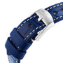 Close-up of a blue leather strap with white stitching and a silver Breitling buckle, paired elegantly with the Breitling Navitimer 32 featuring a blue mother of pearl dial and diamond hour markers.