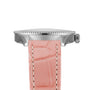 Side view of the Breitling Navitimer 32 with a silver case, beaded bezel, crown, pink leather strap with white stitching, and sparkling diamond hour markers.