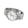 The Breitling Navitimer 32 wristwatch features a stainless steel metal link band, white mother-of-pearl dial with diamond hour markers, and precise SuperQuartz™ movement, shown angled on a white background.