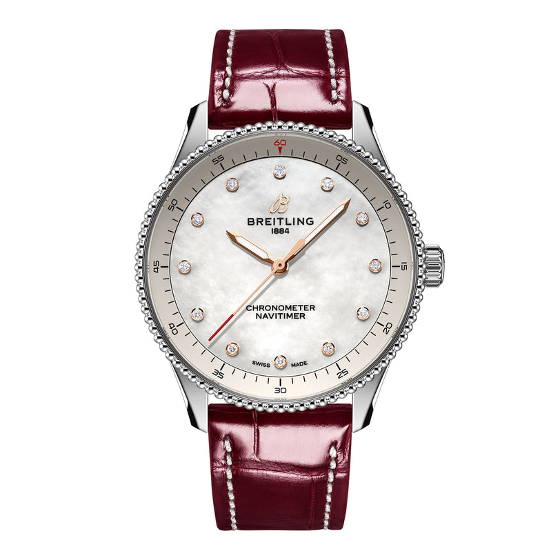 The Breitling Navitimer 32 features a white dial, diamond hour markers, a silver bezel, and a burgundy leather strap, powered by the precise Breitling Calibre 77 SuperQuartz™ movement.