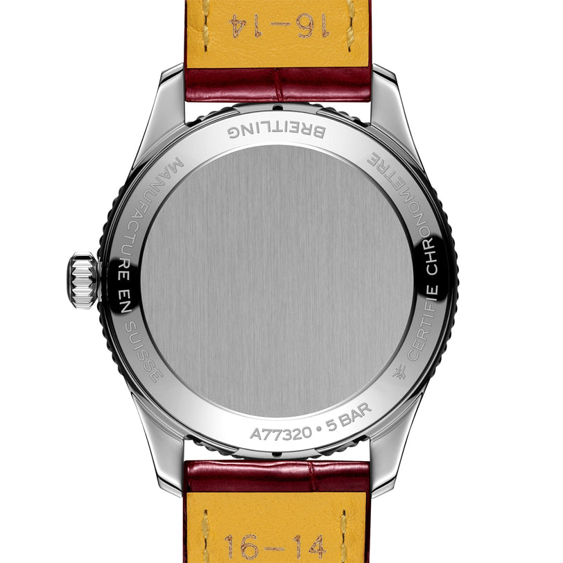 Back view of the Breitling Navitimer 32 with a stainless steel case, brown leather strap, engraved case back markings, and precise SuperQuartz™ movement.