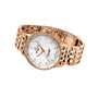 The Breitling Navitimer 32 features an 18K red gold link band, a mother-of-pearl dial with diamond hour markers, and a date window in a rose gold design.