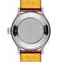 The image displays the back of a Breitling Navitimer Automatic 36, featuring a 36mm stainless steel case, leather strap, and engraved manufacturer details around the edge.