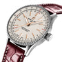 A close-up of the Breitling Navitimer Automatic 36, featuring a cream dial, rose gold markers and hands, 36mm stainless steel case, burgundy leather strap, and precise Breitling 17 movement.