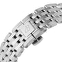 Close-up of a stainless steel Breitling bracelet with engraved B logo clasp, designed for the Navitimer Automatic 36.