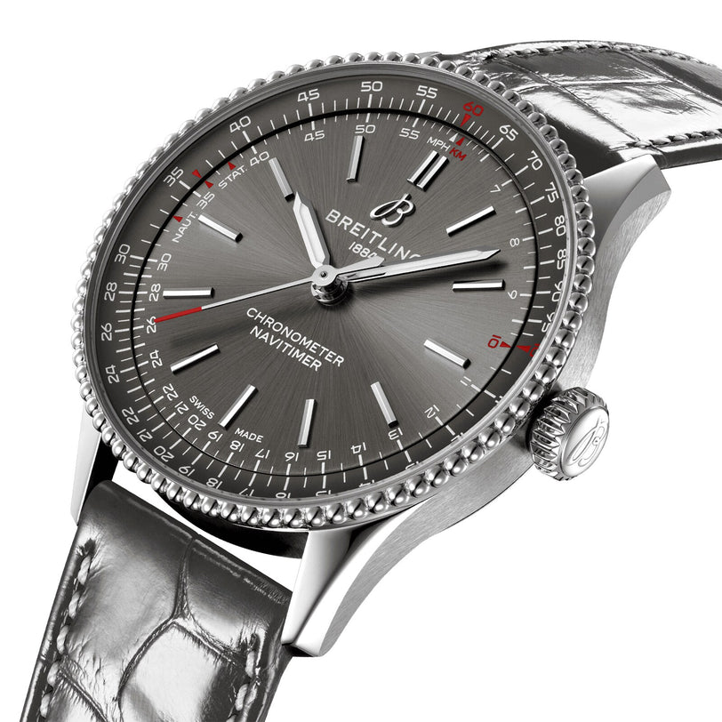 A close-up of the Breitling Navitimer Automatic 36 wristwatch, featuring an anthracite dial, detailed hour markers, and a grey leather strap.