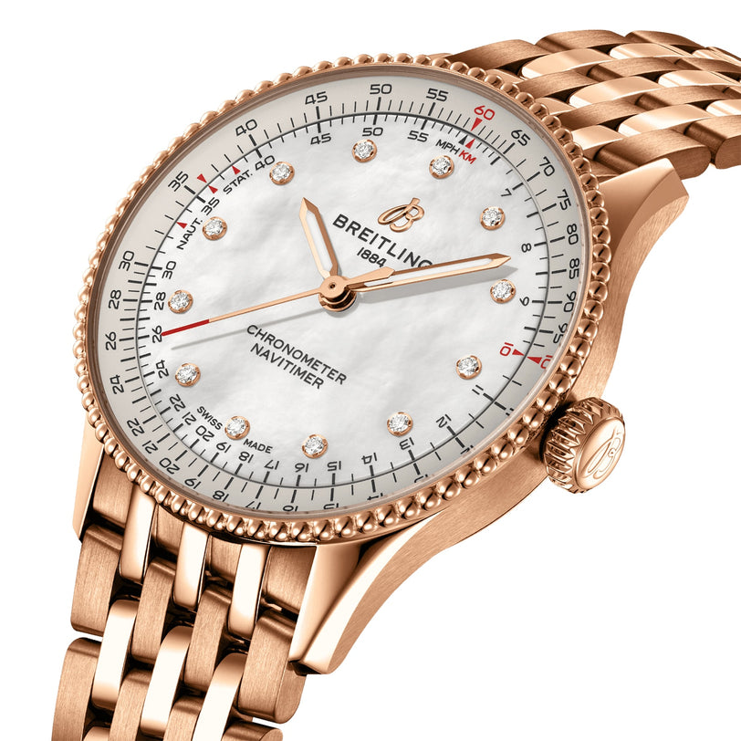 The Breitling Navitimer Automatic 36 features a rose gold case, white mother-of-pearl dial with diamond hour markers, and a matching rose gold bracelet.