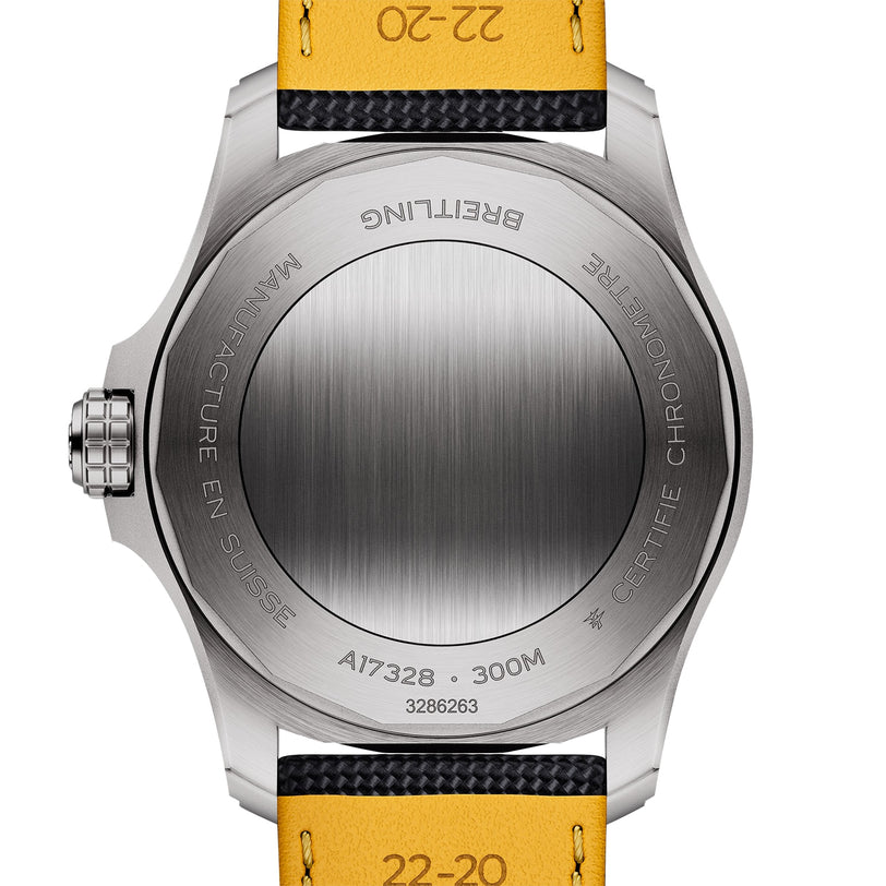 Back view of the Breitling Avenger Automatic 42 watch, showcasing a brushed stainless steel case with visible engravings and a striking yellow and black strap.