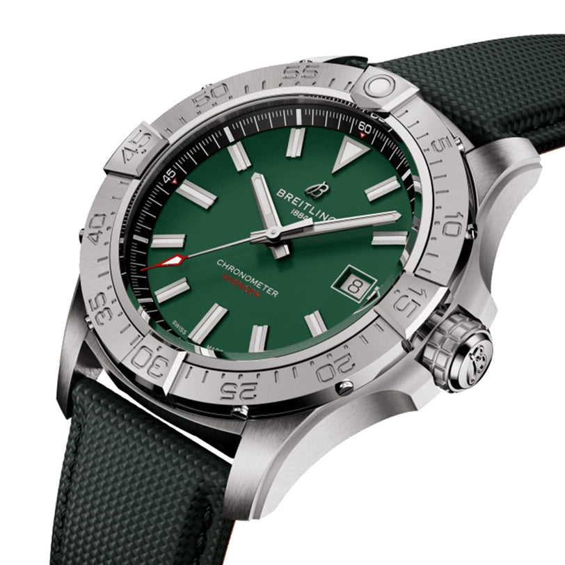 The Breitling Avenger Automatic 42 features a green dial, silver hour markers, date display at 3 o’clock, rotating bezel, and a textured military leather strap.