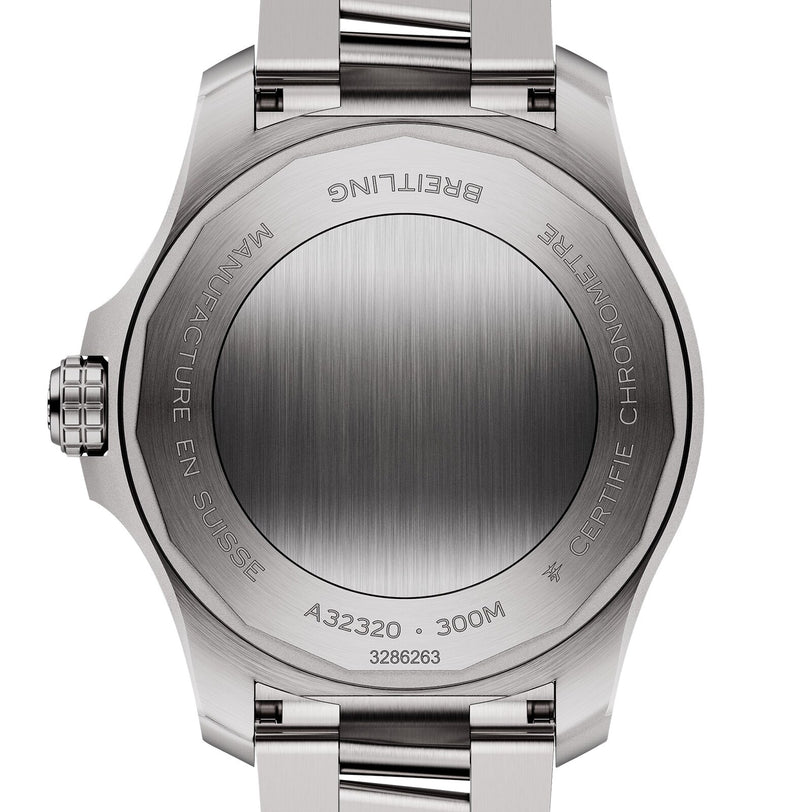 Close-up of the back of a Breitling Avenger Automatic GMT 44, highlighting the engraved metal case back with model details, water resistance, “Automatic GMT,” and “Manufacture en Suisse.”.