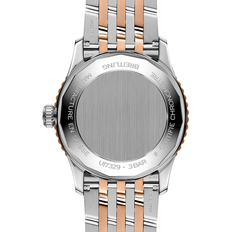 Close-up of the back of the Breitling Navitimer Automatic 41, featuring a stainless steel and rose gold bracelet with engraved case back—showcasing its Calibre 17 movement inspired by classic pilot’s watch design.