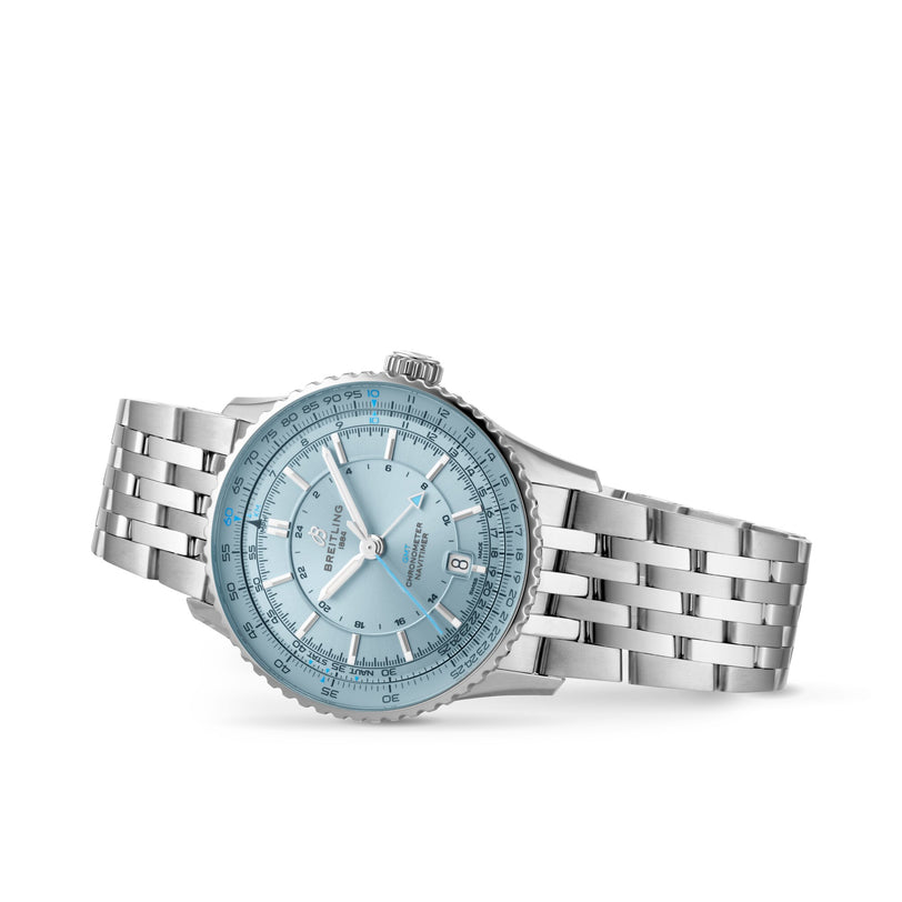 The Breitling Navitimer Automatic GMT 41 features a silver stainless steel bracelet, light blue dial, and date display at 6 o’clock, inspired by iconic Navitimer mechanical chronographs, displayed against a white background.