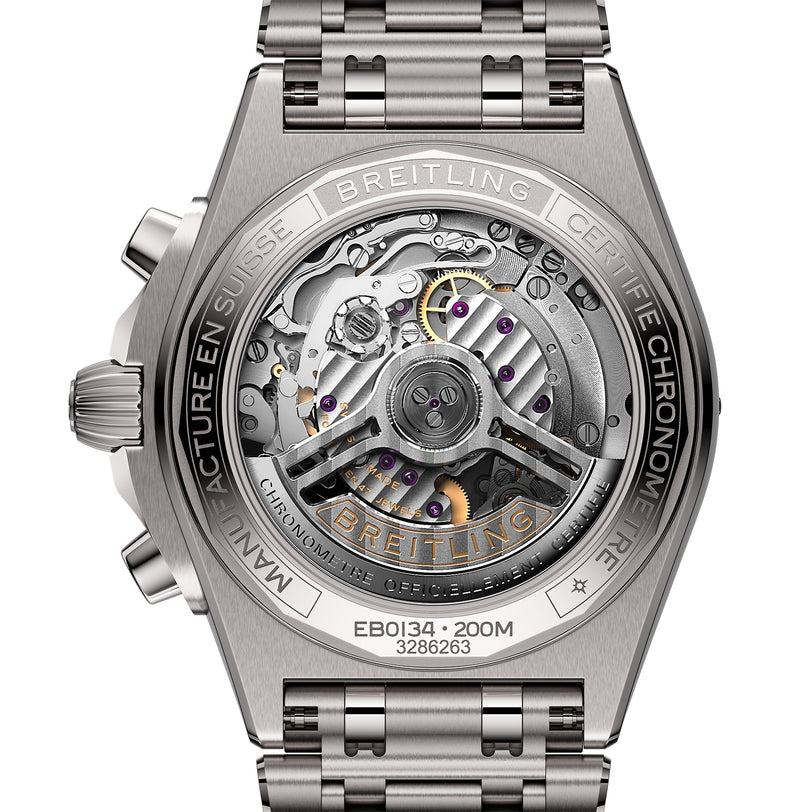Close-up of the back of a Breitling Chronomat B01 42, showcasing its exposed automatic movement, engraved details, and sleek metal bracelet.