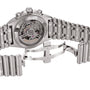 Close-up of a Breitling Chronomat B01 42 watch showing its open metal clasp and the automatic movement visible through the transparent case back.