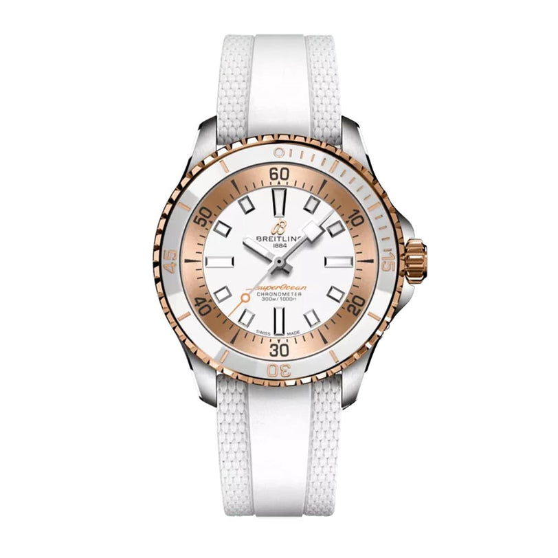 The Breitling Superocean Automatic 36 features a silver and rose gold case, white textured strap, white dial with gold accents, and displays the time at 10:08.