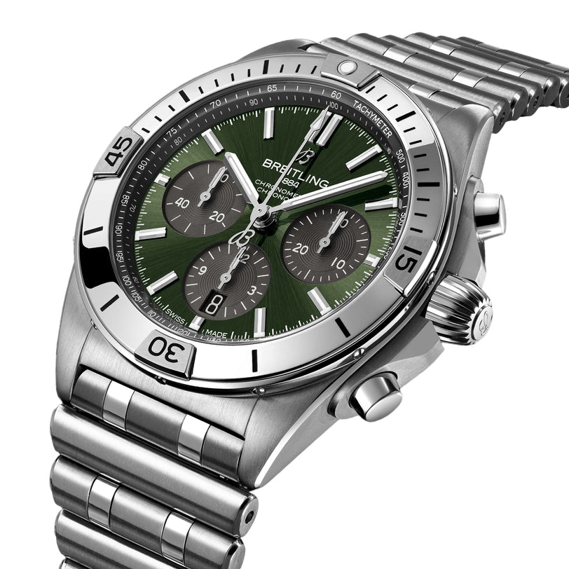 The Breitling Chronomat B01 42 The Watches Of Switzerland Group Centenary Exclusive is a stainless steel chronograph with a green dial, three subdials, metal link bracelet, and B01 Manufacture Calibre for superior precision.