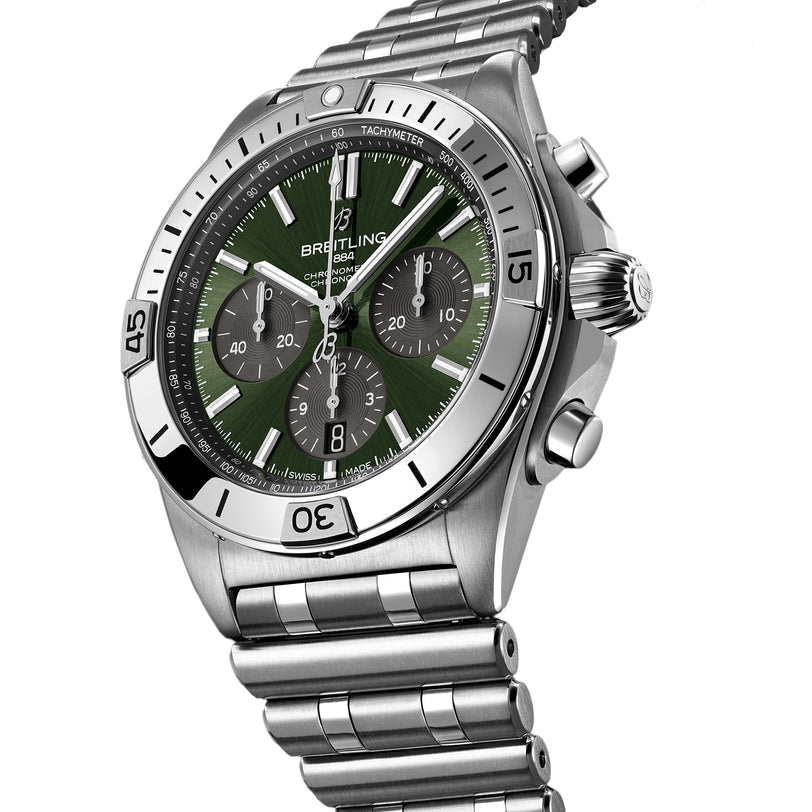 The Breitling Chronomat B01 42 The Watches Of Switzerland Group Centenary Exclusive is a limited edition stainless steel chronograph with a green dial, three subdials, tachymeter scale, metal bracelet, and B01 Manufacture Calibre.