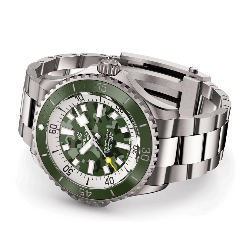 A Breitling Superocean Automatic 46 Super Diver wristwatch featuring a green camo-patterned dial, green rotating bezel, stainless steel link bracelet, and powered by the precise Breitling 10 calibre movement on a white background.
