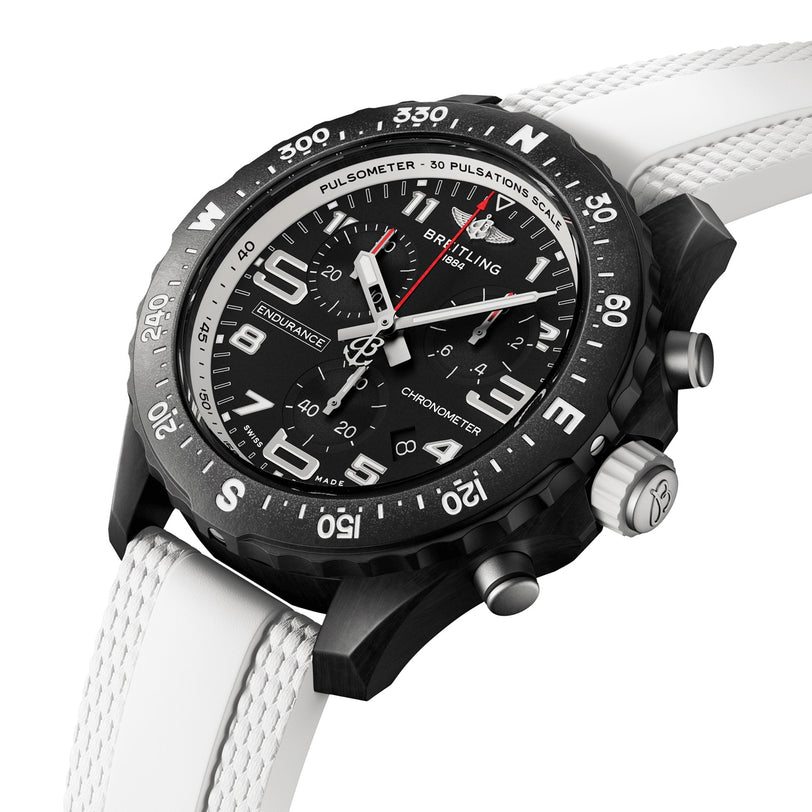 The Breitling Endurance Pro 38 is a black and silver sports chronograph with a white textured strap, three subdials, bold white numerals, and a durable Breitlight case—ideal as an athleisure watch for any occasion.