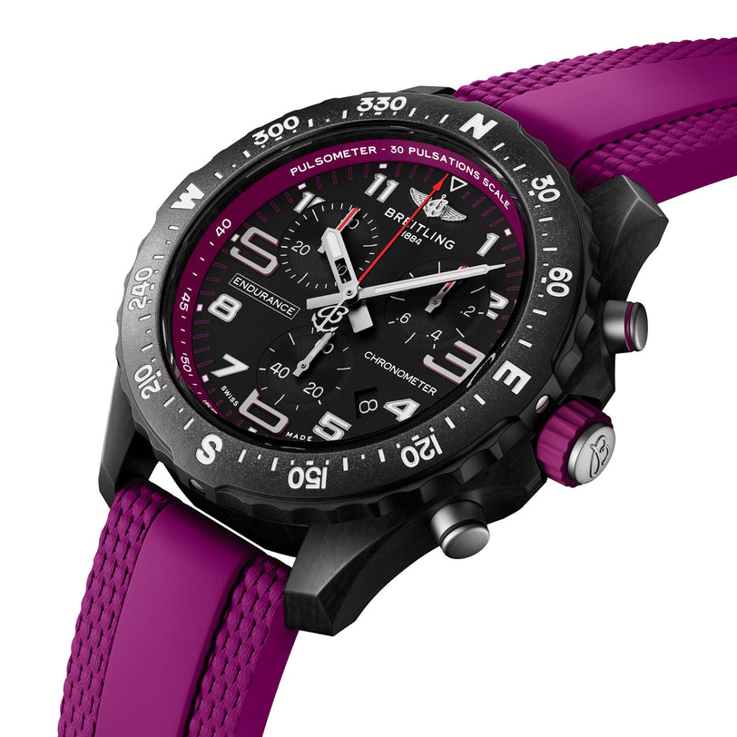 The Breitling Endurance Pro 38 is a sporty chronograph with a black dial, magenta accents, a magenta rubber strap, and a pulsimeter bezel in a robust Breitlight case—ideal for athleisure style.