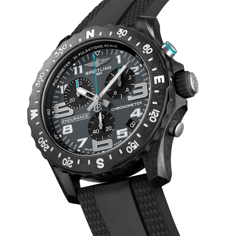 A close-up of the black Breitling Endurance Pro 44 The Watches Of Switzerland Group Exclusive, featuring a rotating bezel, three subdials, and a black rubber strap—highlighting Breitlings luxury and chronometer-certified precision.