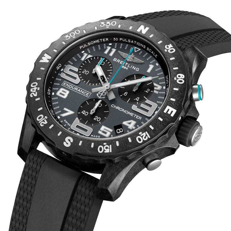 Close-up of the Breitling Endurance Pro 44 The Watches Of Switzerland Group Exclusive, a luxury black chronograph with a rubber strap, visible dials, pulsometer bezel, and renowned chronometer-certified movement.