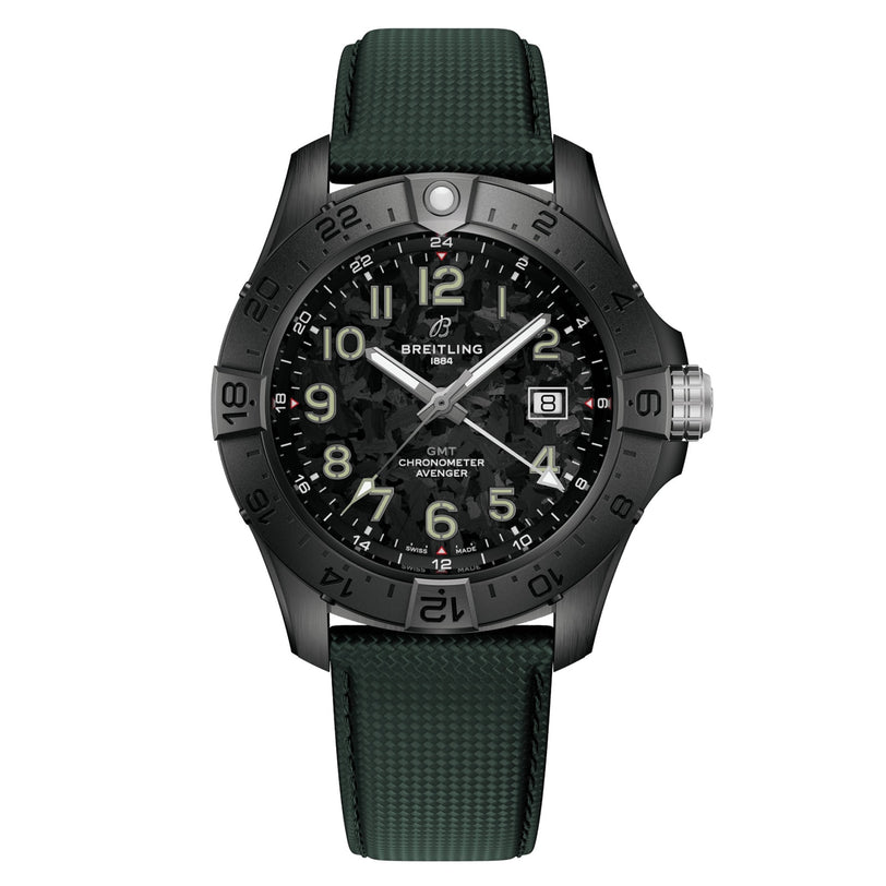 The Breitling Avenger Automatic GMT 44 Night Mission features a black aviation-inspired design, camo-patterned dial, green textured strap, numbered bezel, date at 3 o’clock, and luminous hands and markers.