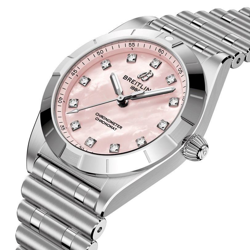 The Breitling Chronomat 28 is a stainless steel wristwatch featuring a pink mother-of-pearl dial, lab-grown diamond hour markers, and a silver metal link bracelet.