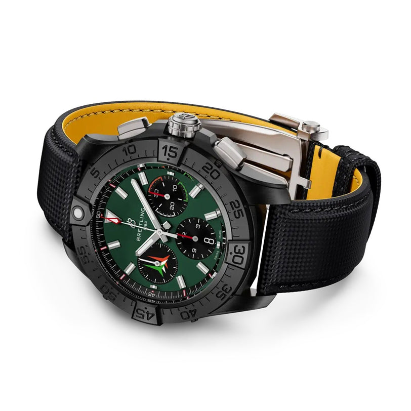 The Breitling Avenger B01 Chronograph 42, inspired by the Frecce Tricolori, has a green dial, black bezel, chronograph functions, and a black textured strap with a yellow underside—echoing the famed squadron’s exceptional resilience.