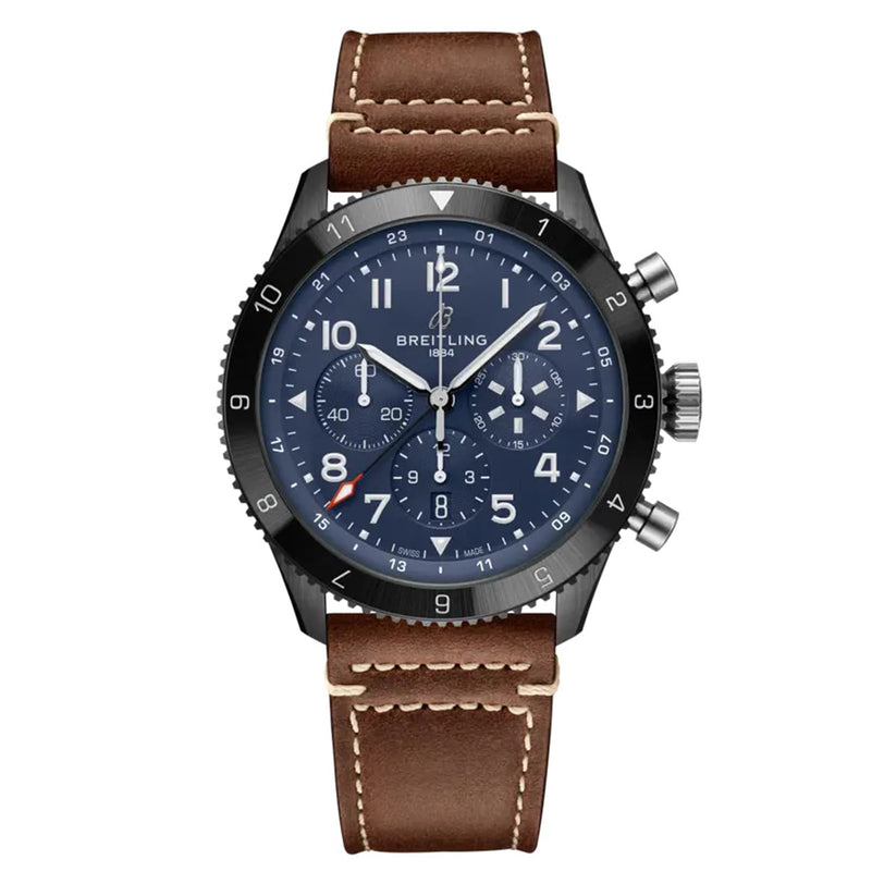 The Breitling Super AVI B04 Chronograph GMT 46 Tribute To Vought F4U features a blue dial with white numerals, three subdials, a black bezel, and a brown leather strap with white stitching—ideal for aviation fans.