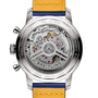 Close-up of the Breitling Top Time B01 Gino Bartali’s caseback, highlighting its exposed mechanical movement, engraved details, and vibrant yellow leather strap.