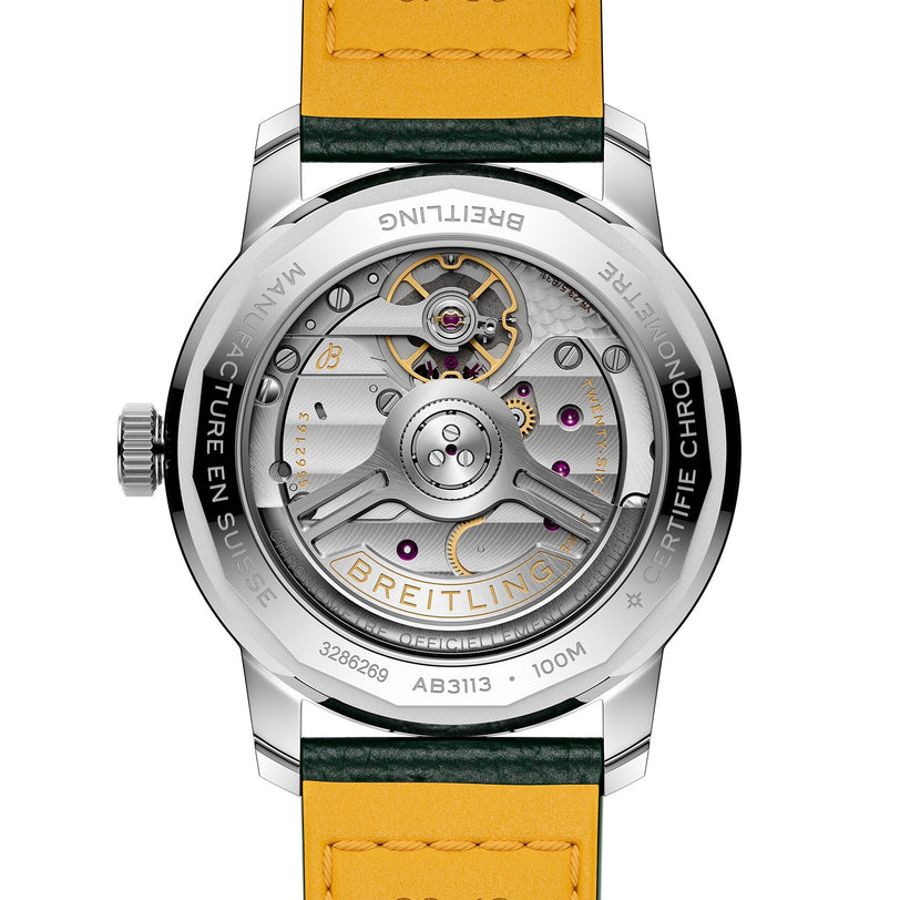 Back view of the Breitling Top Time B31 reveals its retro style, exposed Manufacture B31 movement, engraved metal case, and a yellow leather strap with green edges.