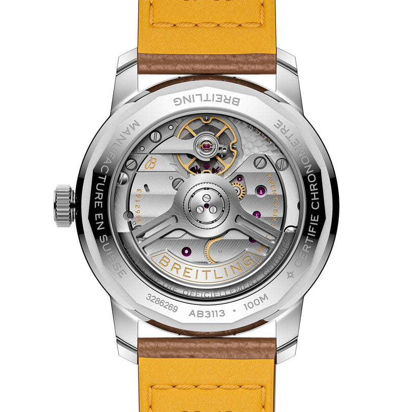 Back view of the Breitling Top Time B31 watch highlighting its exposed Manufacture B31 movement, engraved accents, and a yellow leather strap inspired by retro aesthetics.