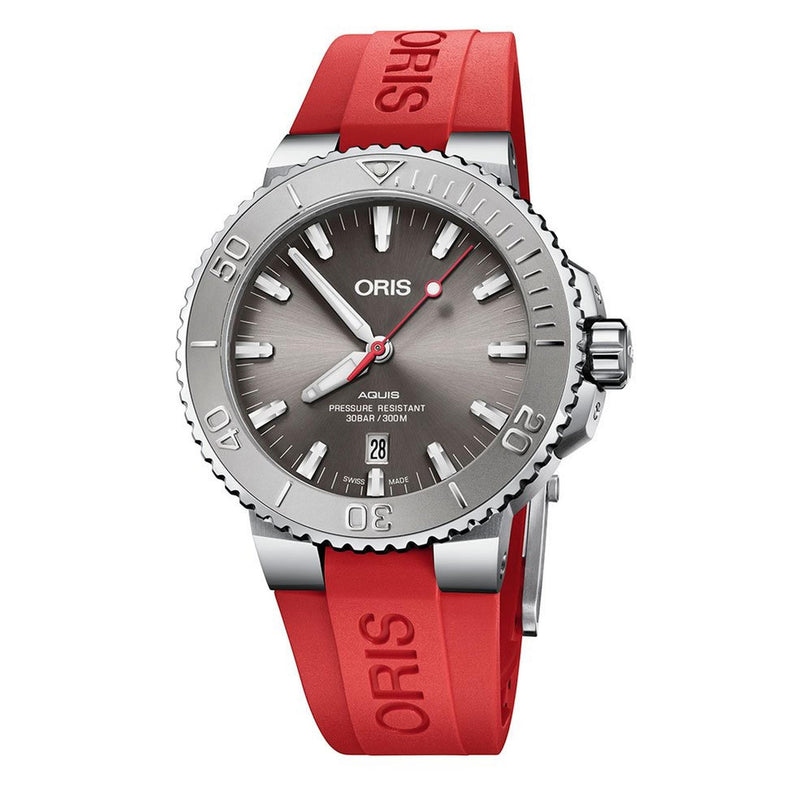 The Oris Aquis Date Relief features a stainless steel case, gray dial, date at 6 o’clock, and a red ORIS-embossed rubber strap—designed for serious divers.