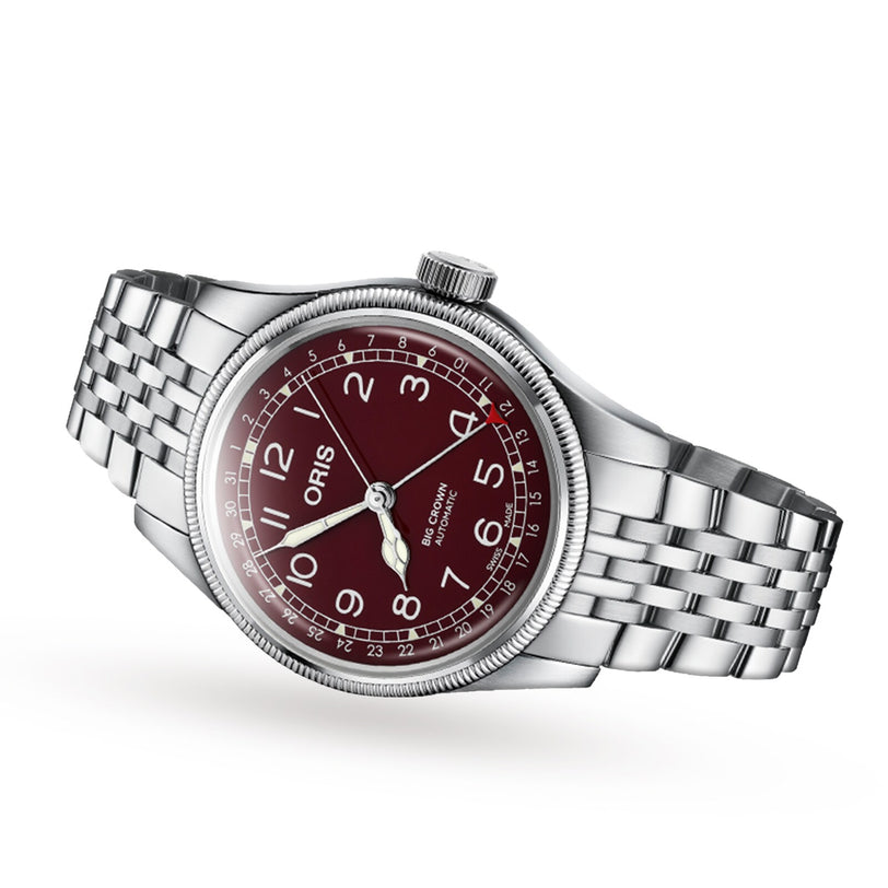 The Oris Big Crown Pointer Date wristwatch features a silver case, red dial with white numerals, and a metal link bracelet, displayed on a white background.