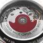 Close-up of the mechanical movement inside the Oris Big Crown X Cervo Volante, showcasing a red rotor and engraved SWISS MADE ORIS HIGH MECH text—a standout timepiece crafted for professional pilots.