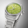The Oris ProPilot X Kermit Edition wristwatch features a green dial and metal bracelet, displayed against a grey background.