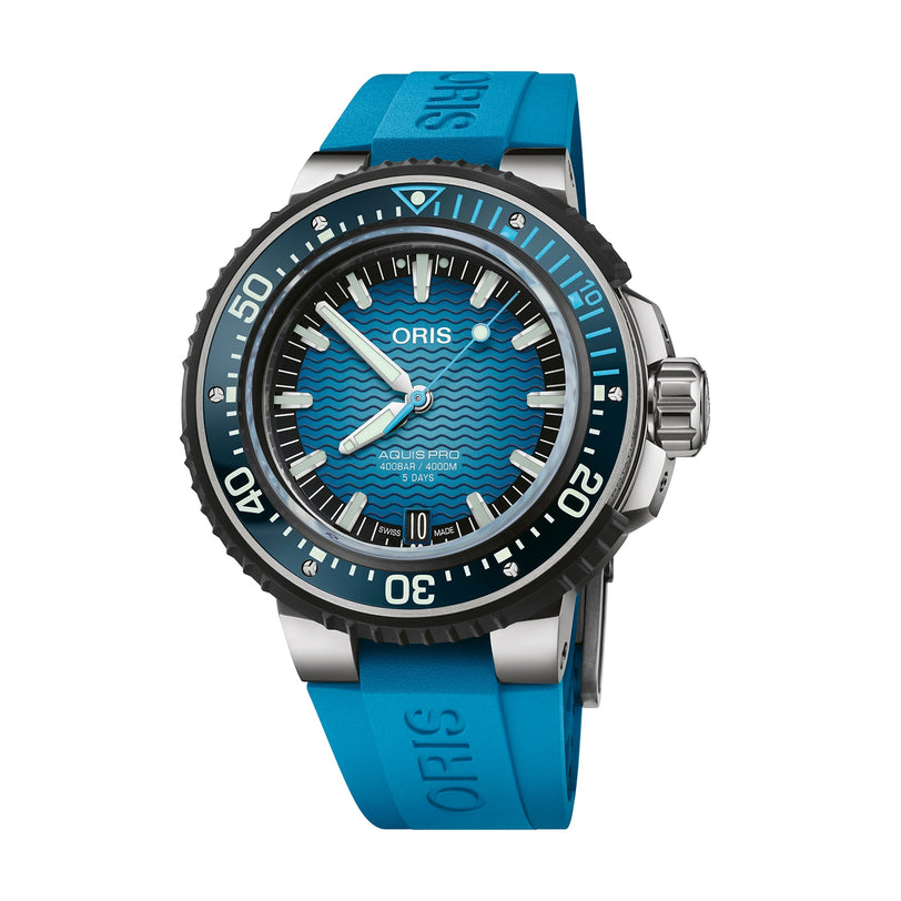 The Oris Aquis Pro 4000M is a blue dive watch with the Rotation Safety System, a wavy dial, black bezel, and matching blue rubber strap.