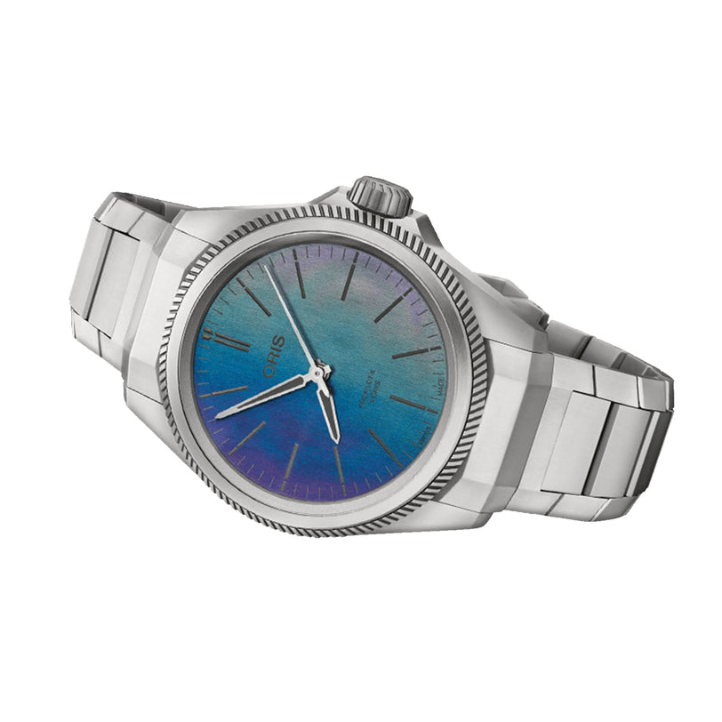The Oris ProPilot X Calibre 400 Laser is a stainless steel watch with a metallic link band and a blue-purple gradient dial, created by lasering technique and featuring the Oris brand name.