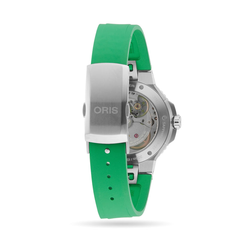 Back view of the Oris Aquis Date Calibre 400 dive watch with a green rubber strap, stainless steel clasp bearing the ORIS name, and its mechanical movement visible through a transparent case back.