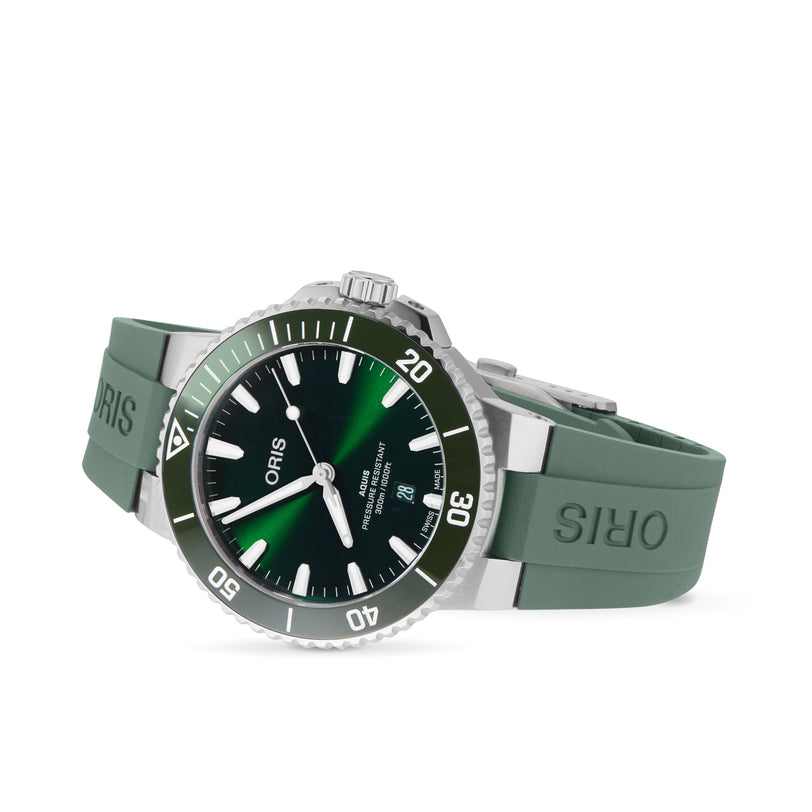 The Oris Aquis Date Calibre 400 is a green dive watch with a matching rubber strap, silver case, rotating bezel, and black dial with white markers and hands—a standout mechanical diving watch from Oris.