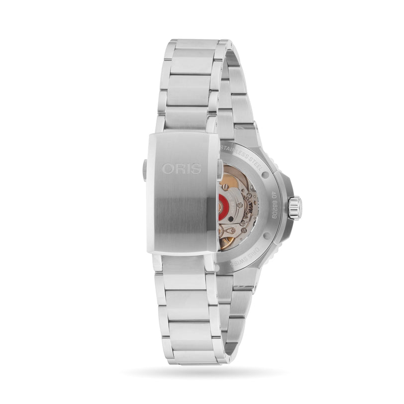 The Oris Aquis Date wristwatch is displayed from the back, highlighting its transparent case back and visible mechanical movement, features typical of high-quality diving watches.